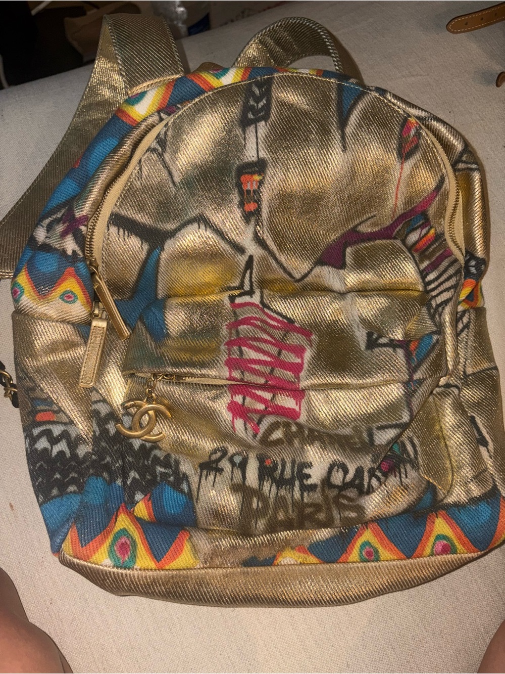 CHANEL Gold Backpack with Multicolor Graphic Accents
